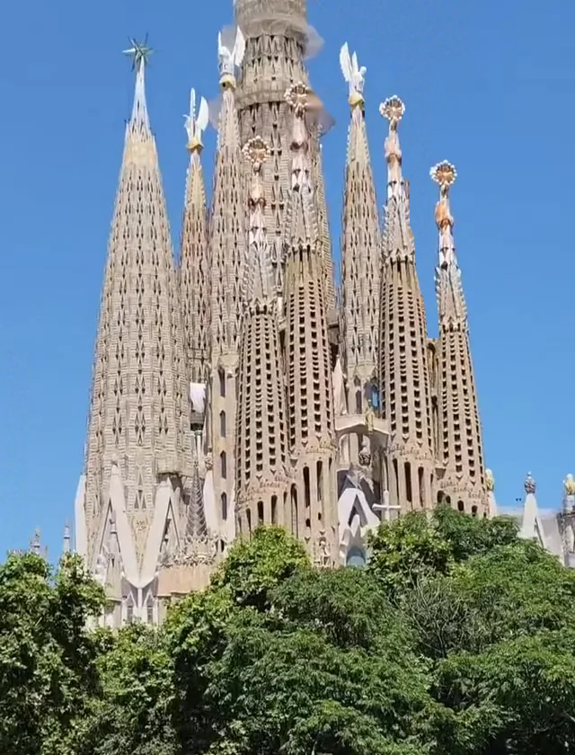 The towers of the Sagrada Família above the trees, a five-minute walk from the restaurant